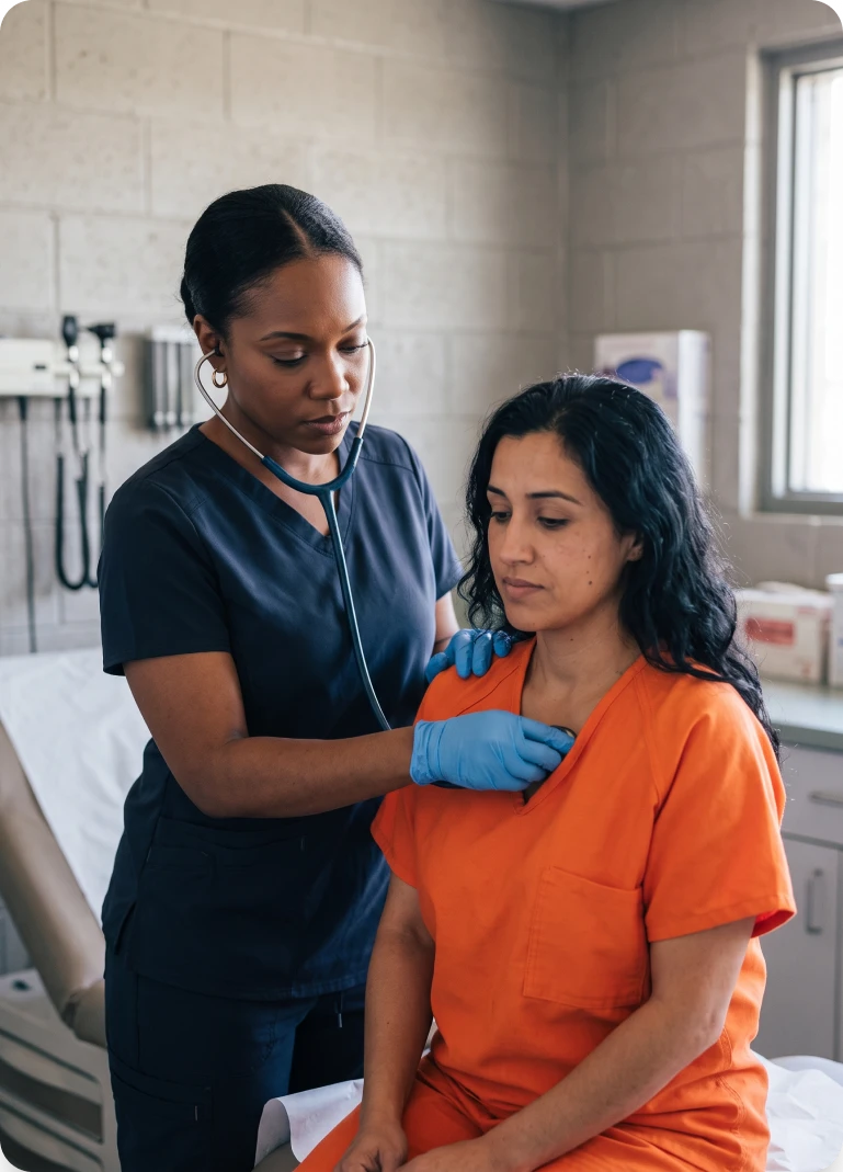 A nurse listens to a patient’s heartbeat during an exam